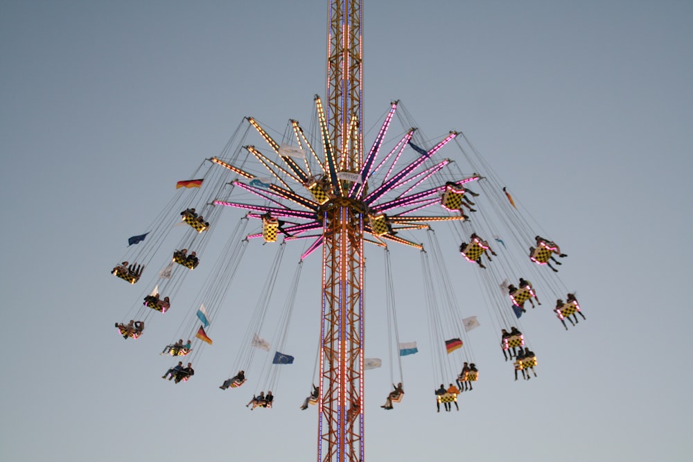 a ferris wheel with people on it