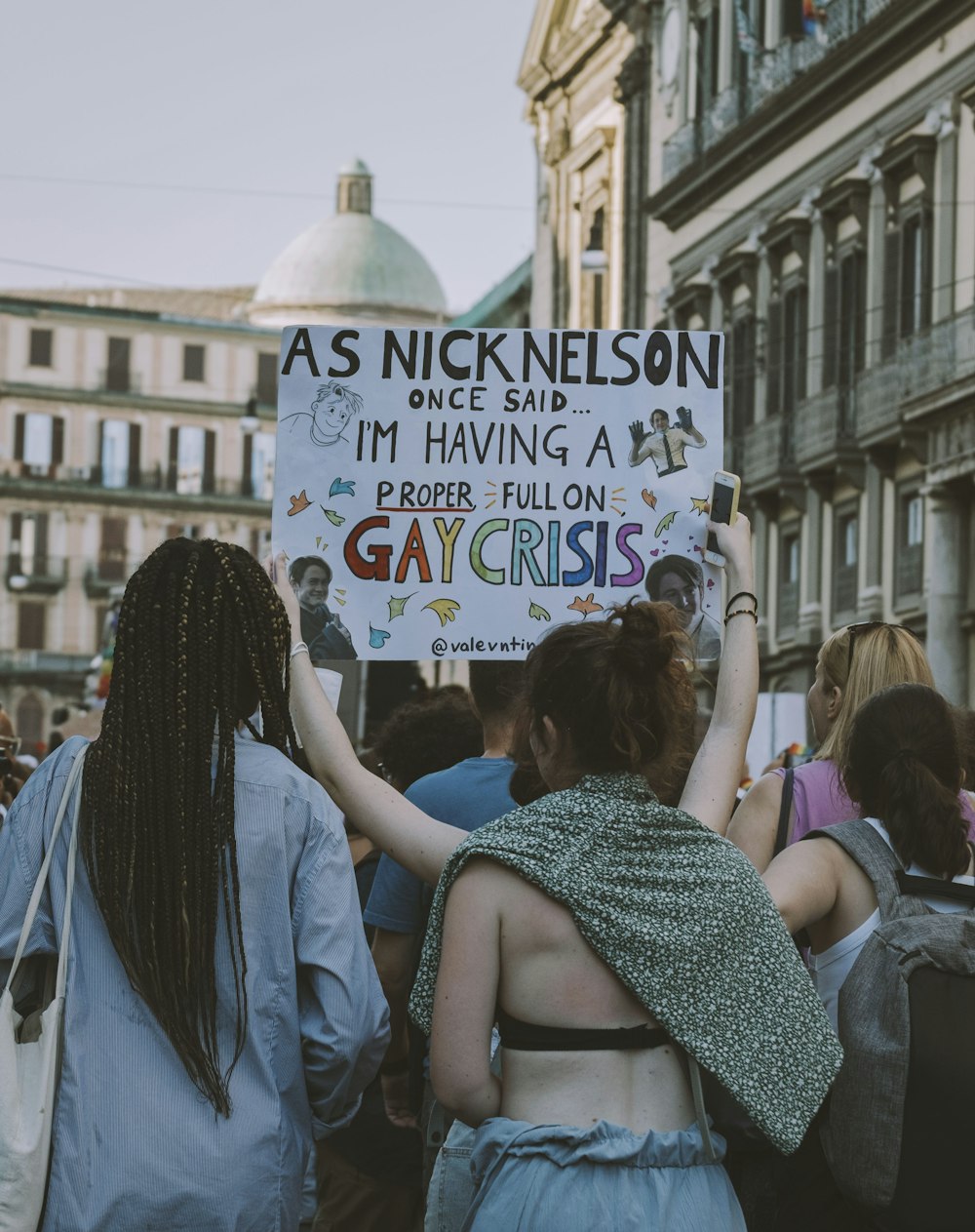 a group of people holding a sign