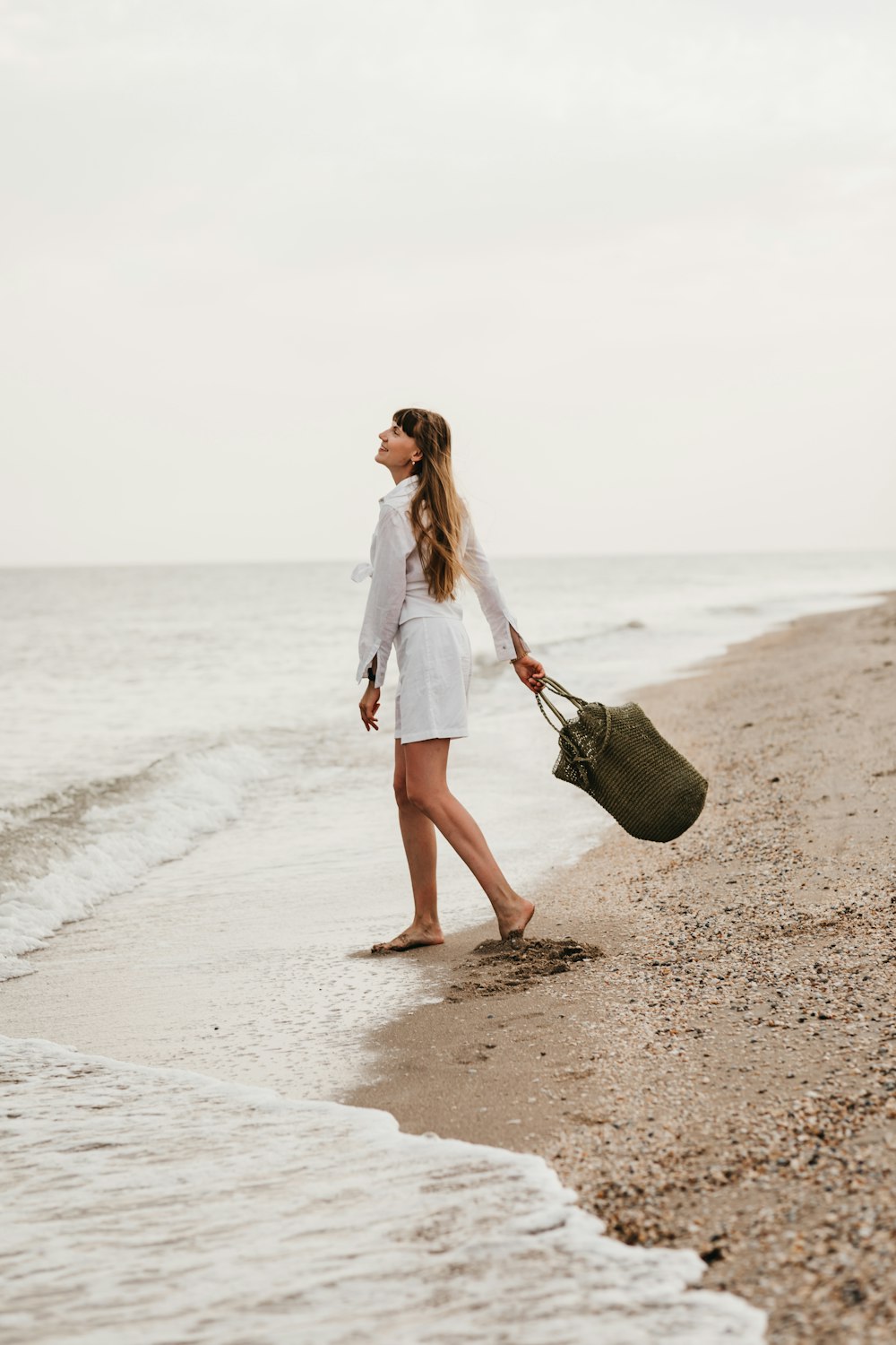 a man walking on a beach