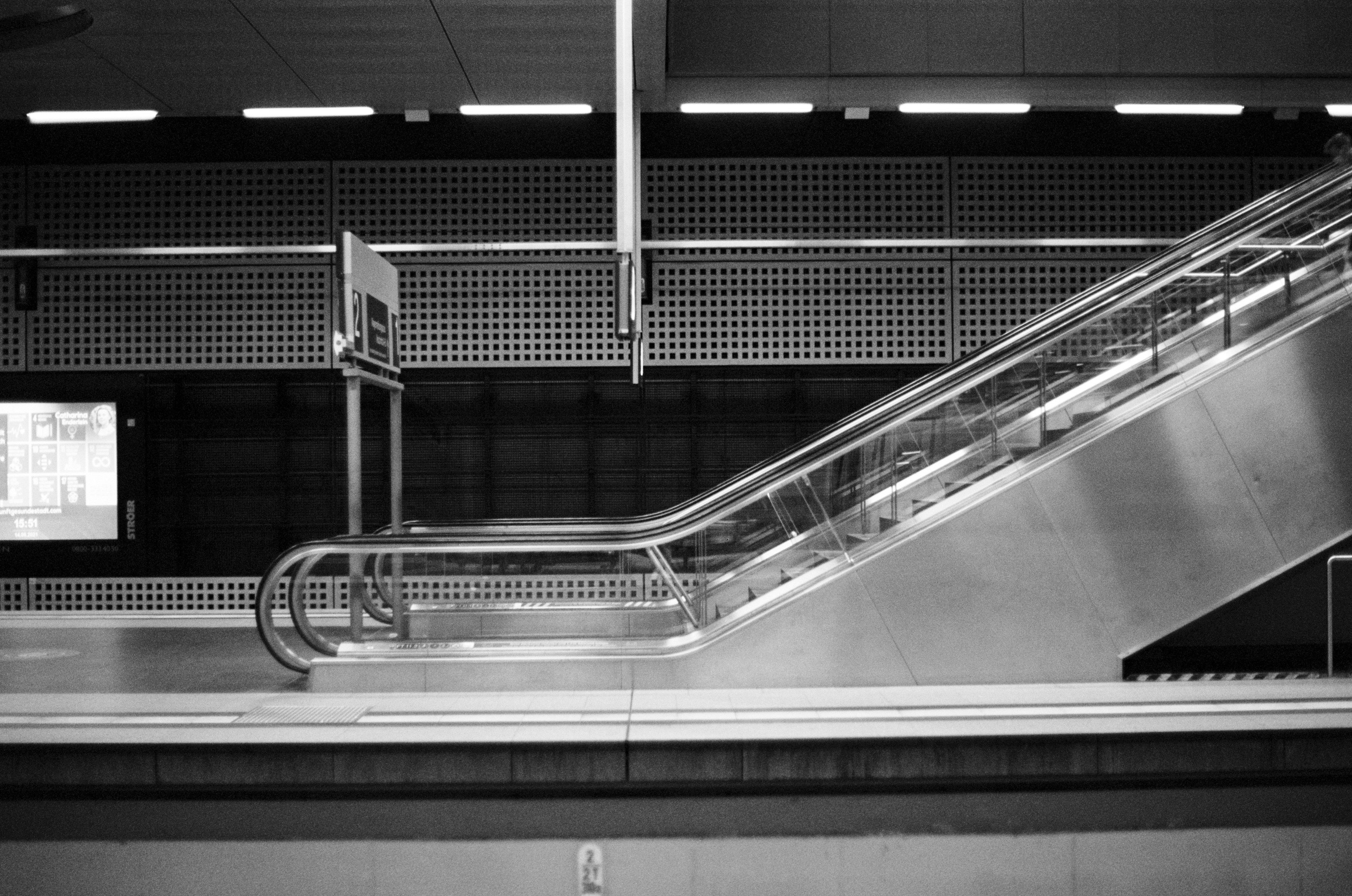 a close-up of a staircase, Local urban micro mobility S-Bahn, Tram, Subway, U-Bahn, Underground. Leica R7 (1994), Summilux-R 1.4 50mm (1983). Hi-Res analog scan by www.totallyinfocus.com – Kodak Professional BW 400 CN (expired 2001)