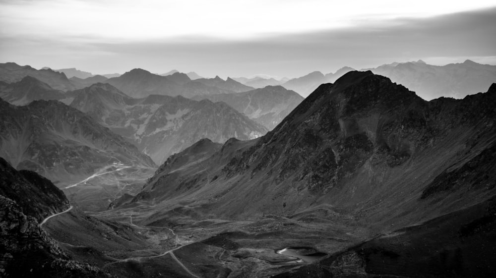 a valley with mountains in the background