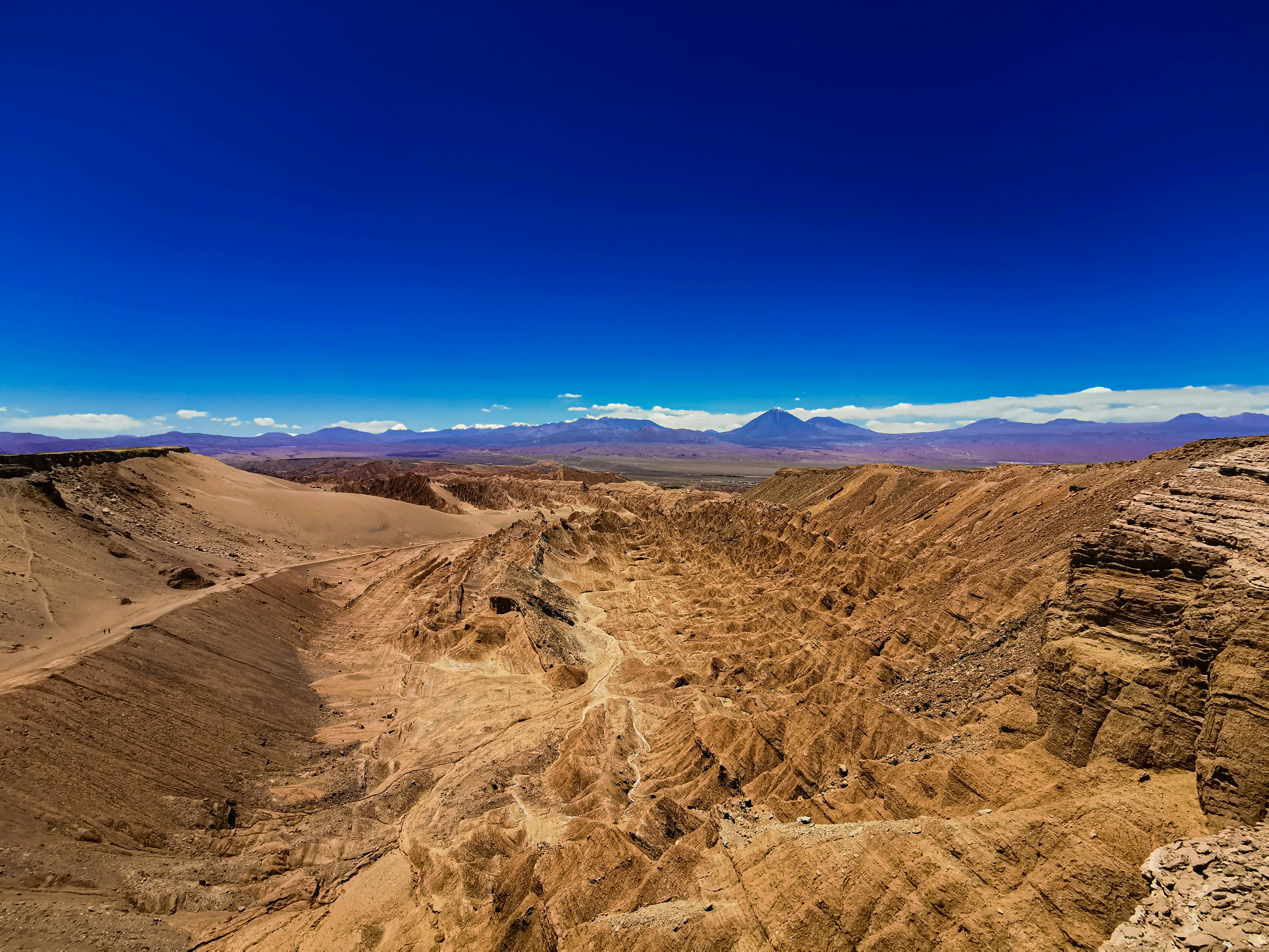 a desert landscape with mountains in the background