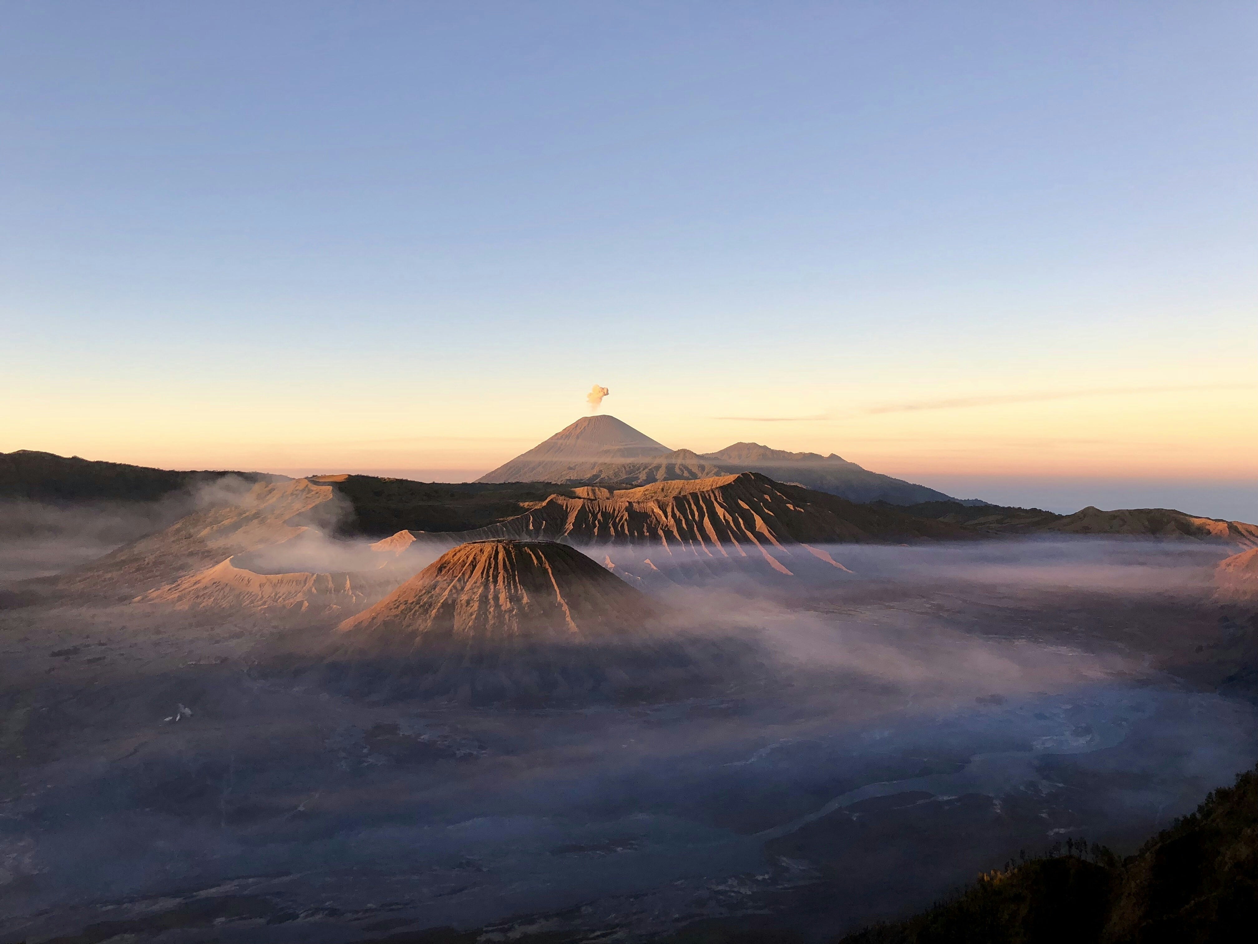 Arenal Volcano framed by morning mist as seen from hotel window.