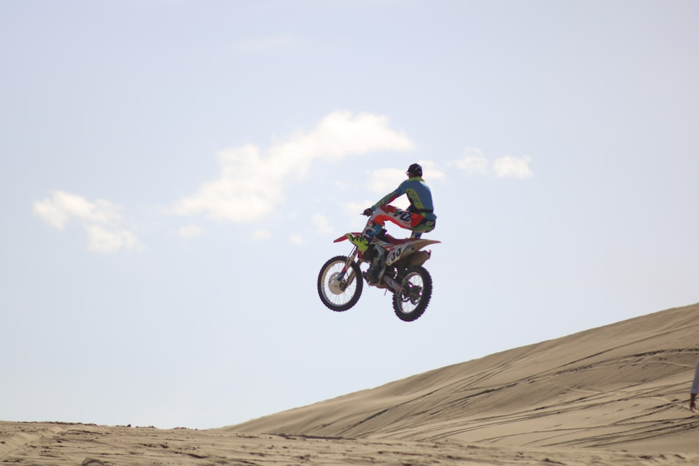 a man riding a motorcycle in the desert