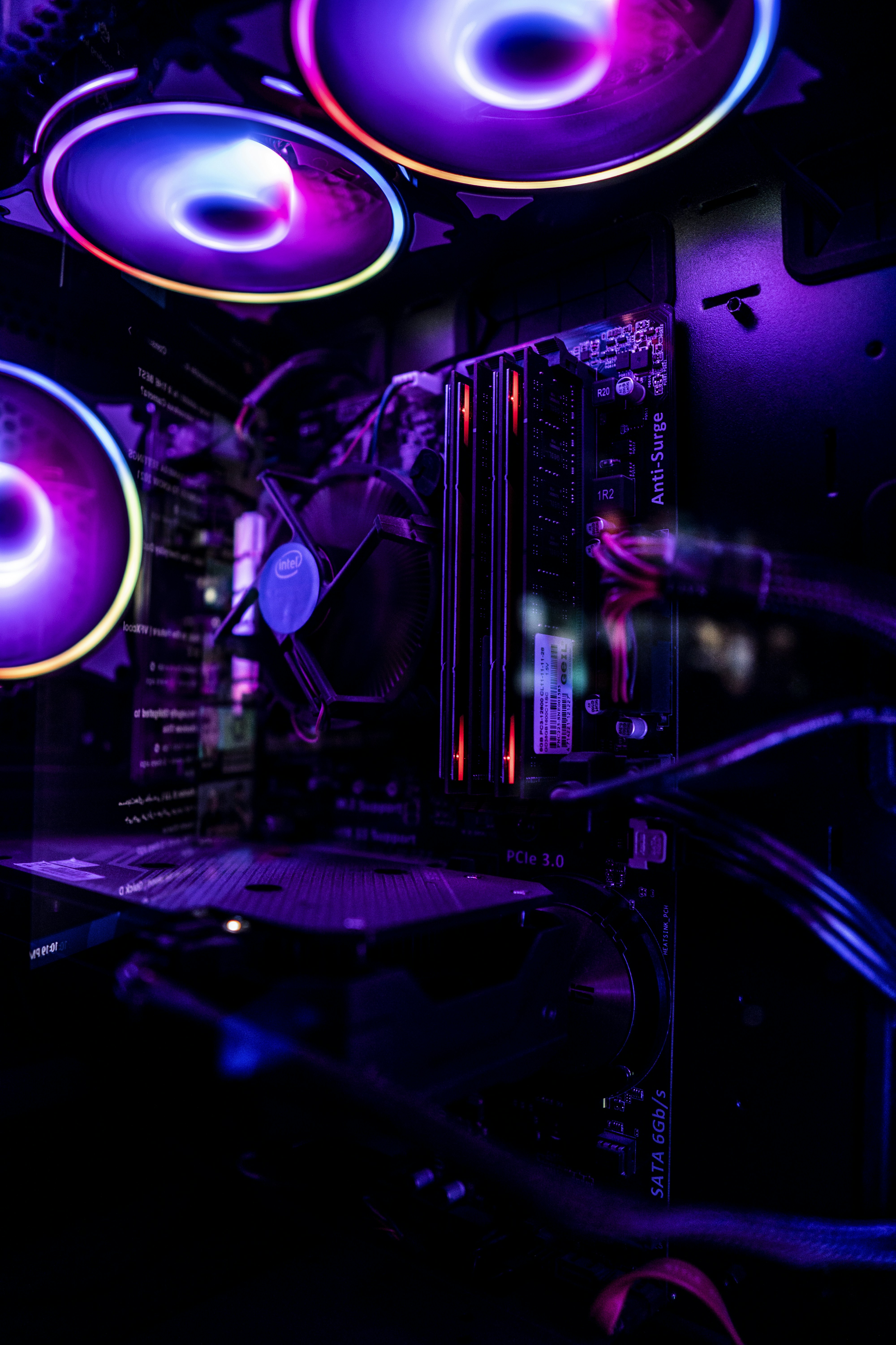 a room with a large screen and purple lights