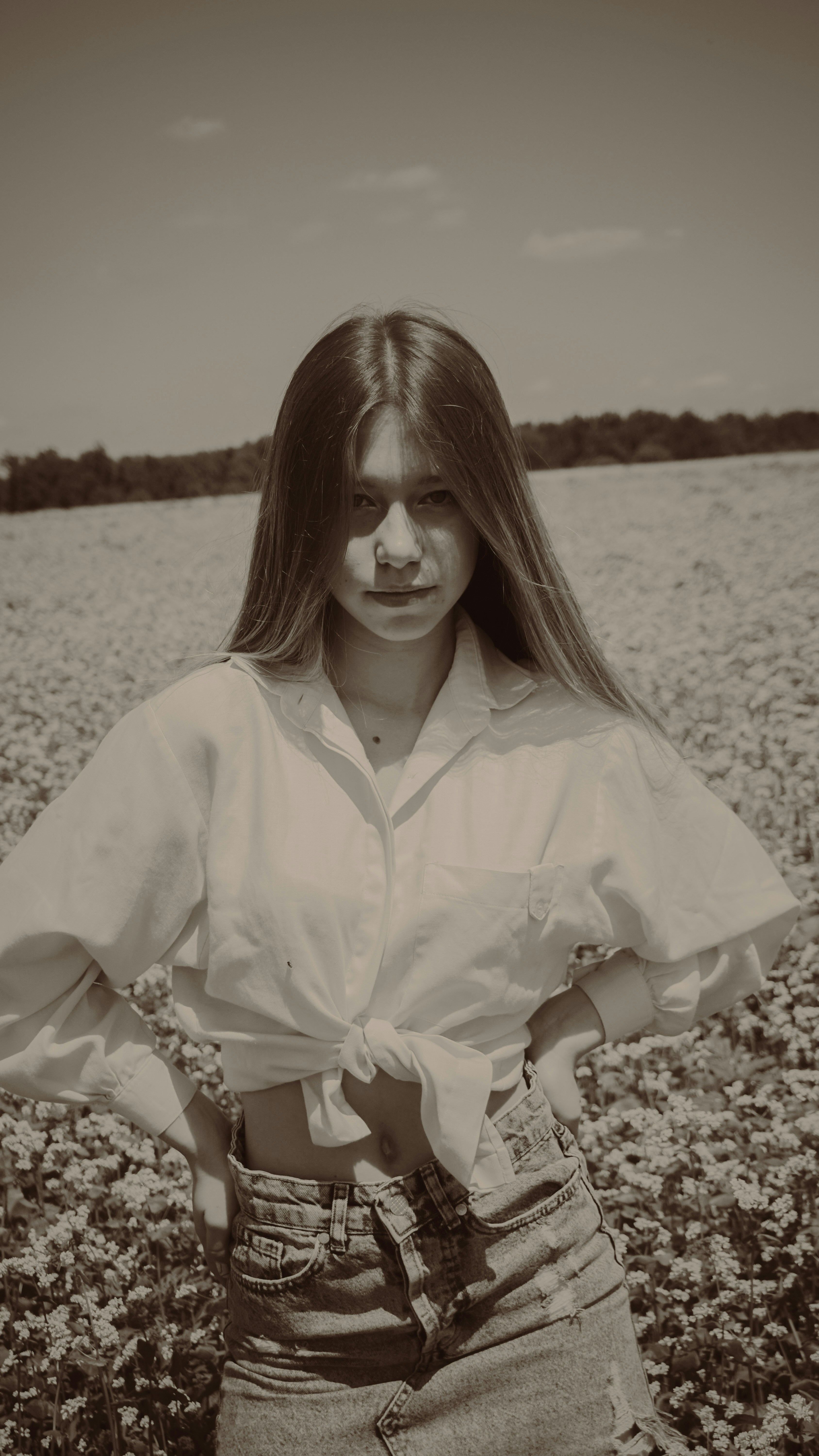 a woman standing in a field