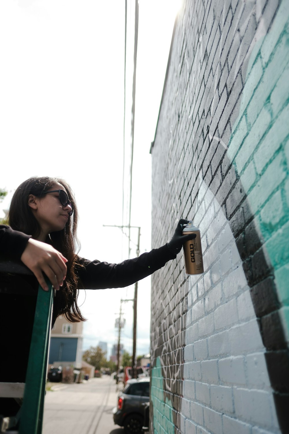 a person leaning against a wall