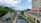 Couple admiring Panama Canal locks under bright blue sky