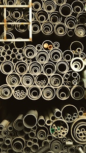 A bustling warehouse with neatly stacked pipes and fittings ready for bulk distribution.