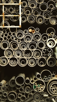 Neatly arranged UPVC pipes of various diameters displayed in the showroom.
