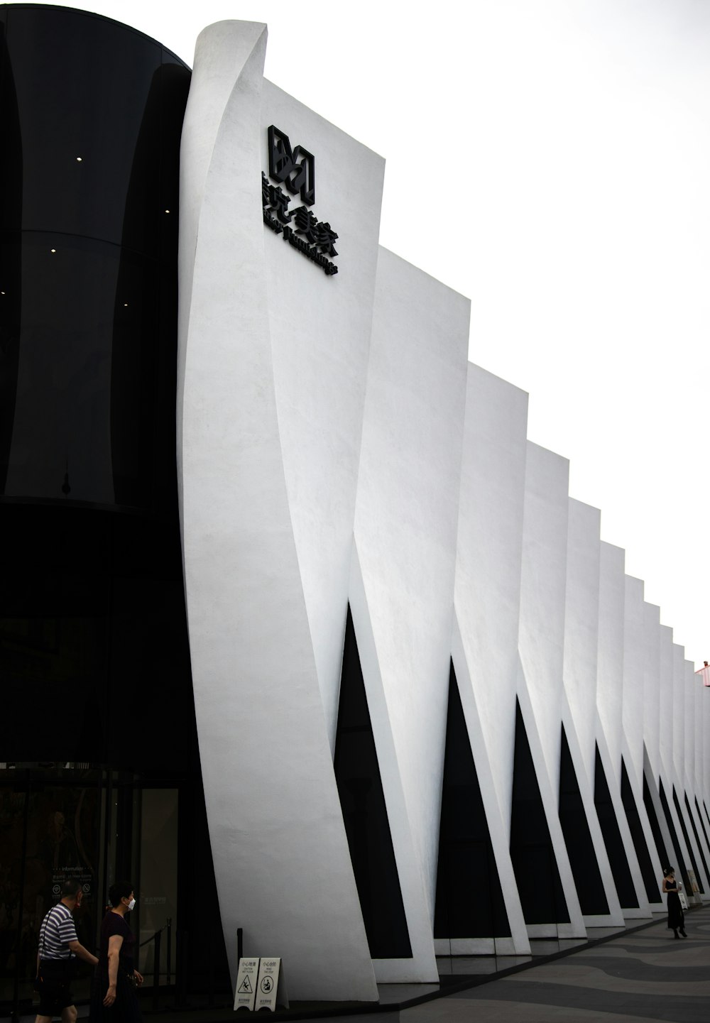 a large white building with a black and white design