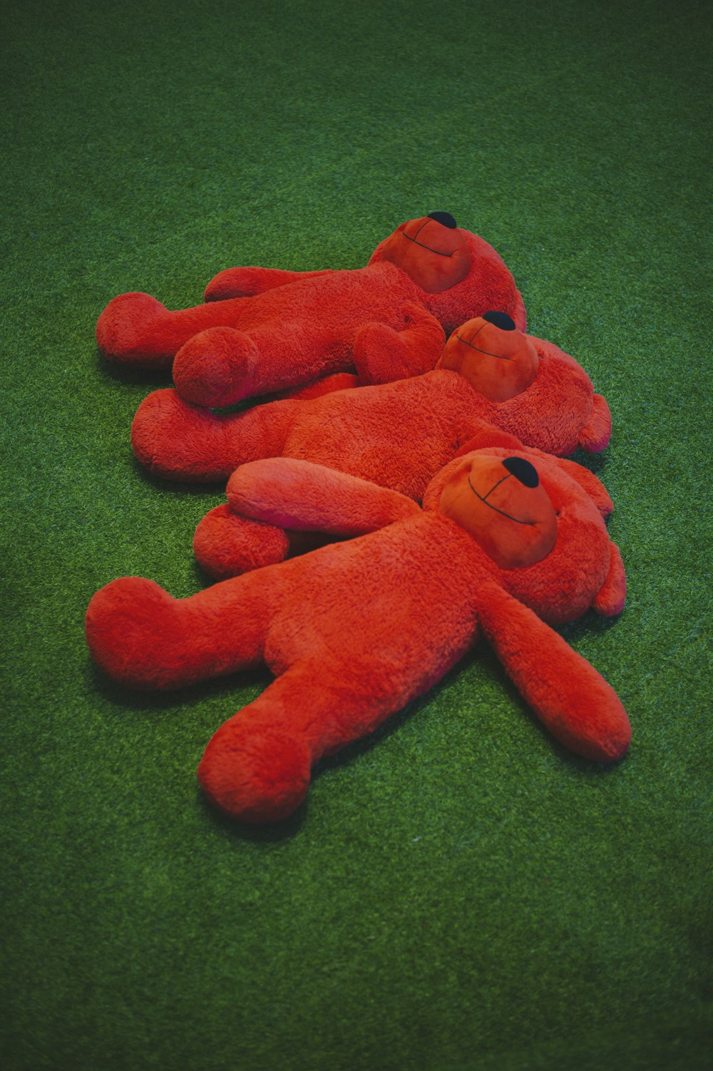 a group of orange stuffed animals