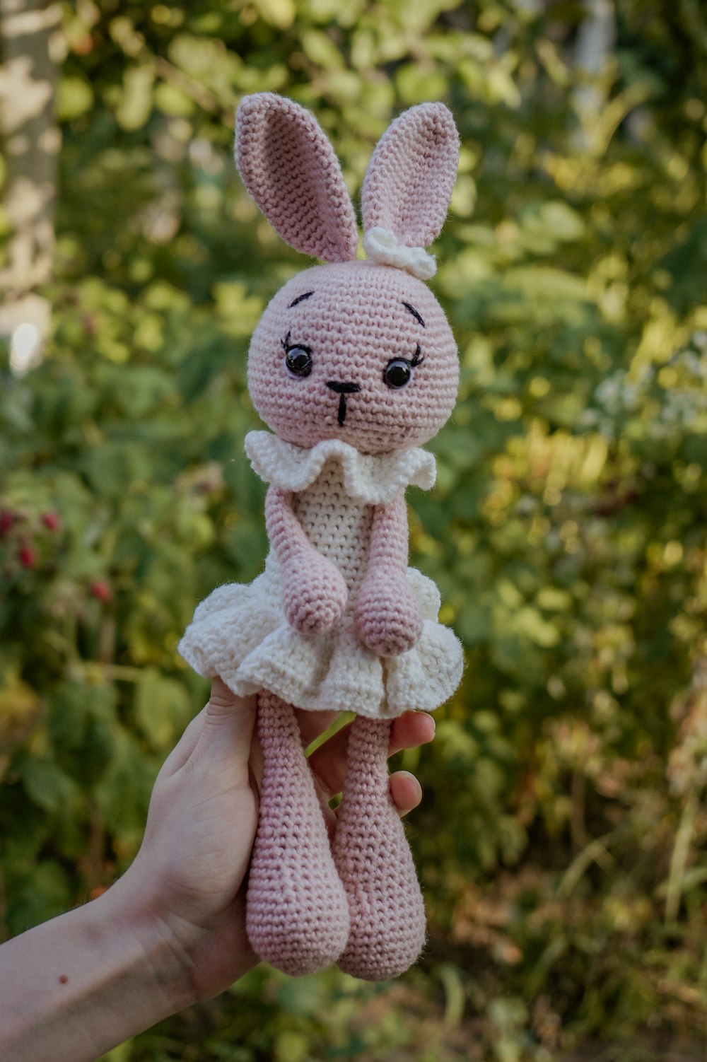 a person holding a stuffed animal