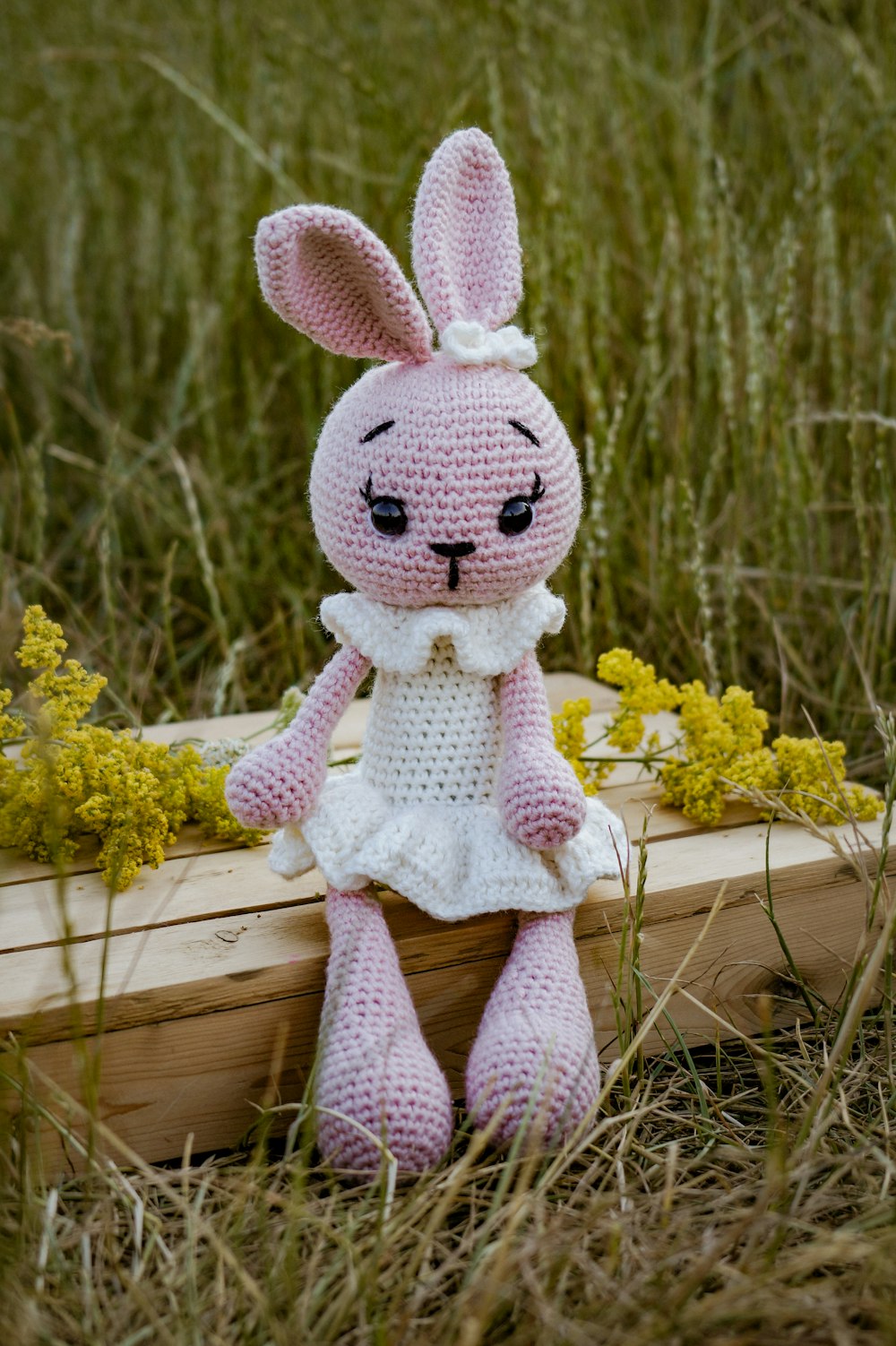 a stuffed animal on a branch