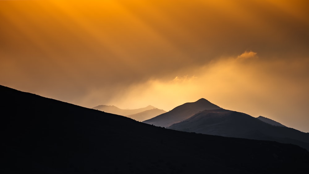 a mountain range with a sunset