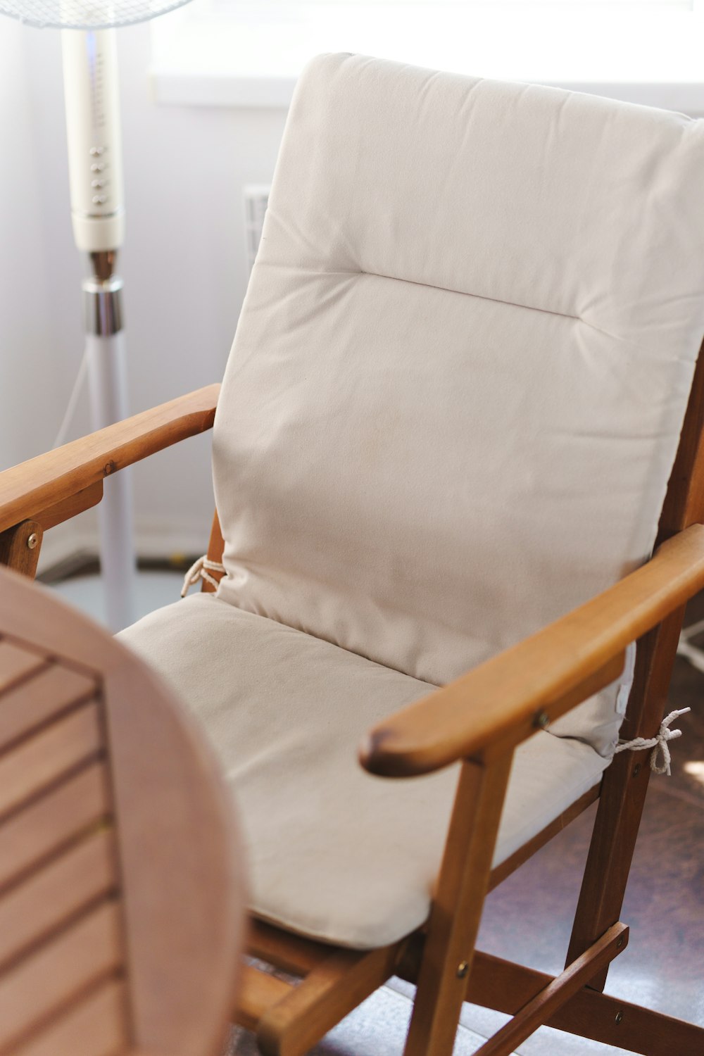 a white chair with a lamp