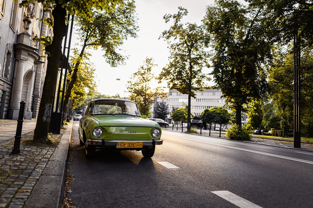 a green car on a street