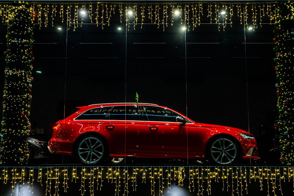 a red car parked in a window