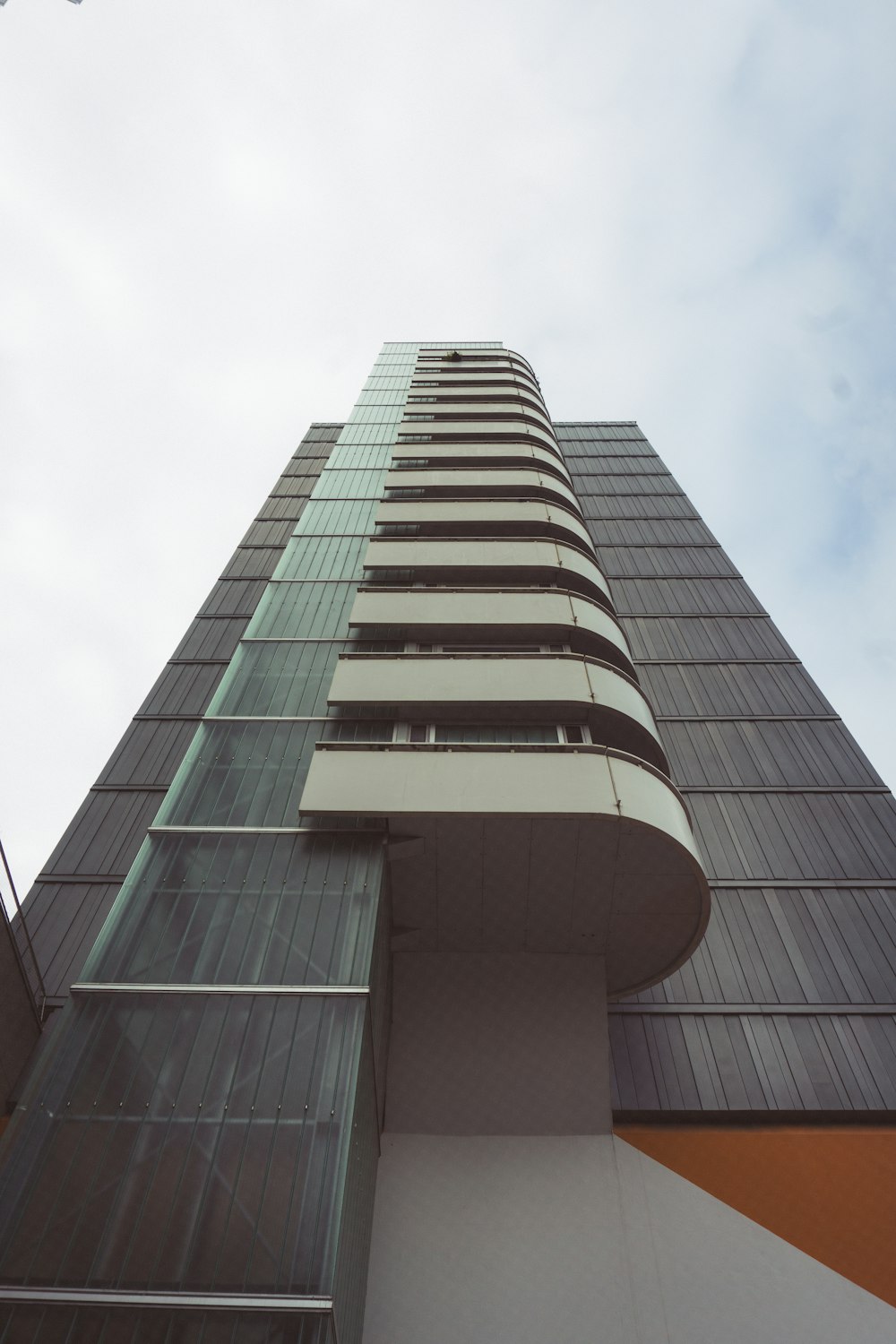 a tall building with a glass front