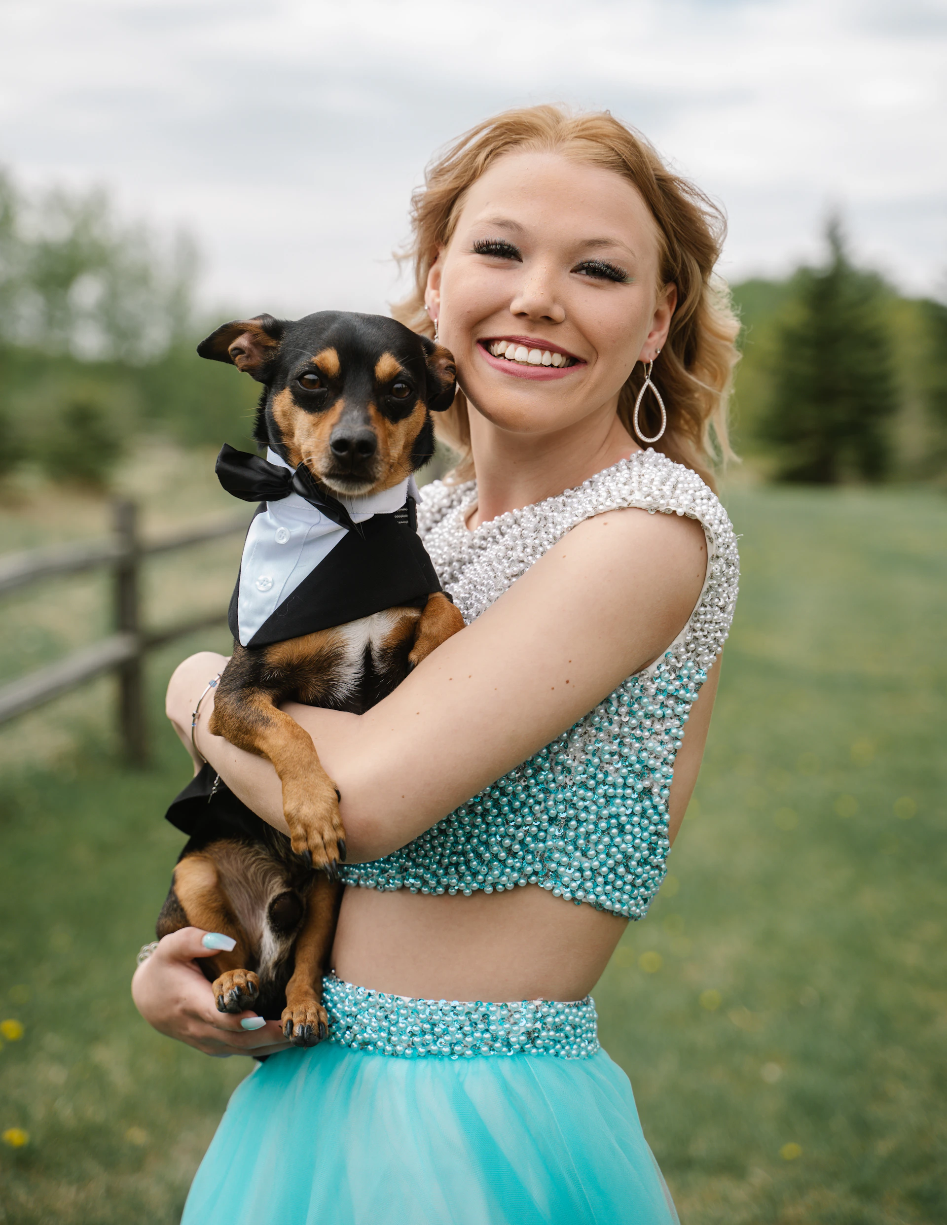 a woman holding a dog