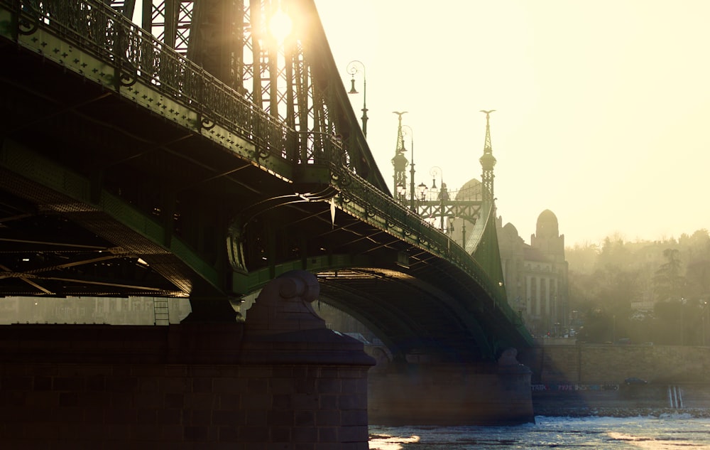 a bridge with a building in the background