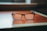 A close-up of stylish eyeglasses displayed on a wooden table.