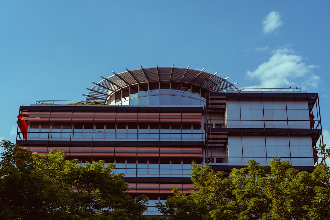 a building with trees in front of it,