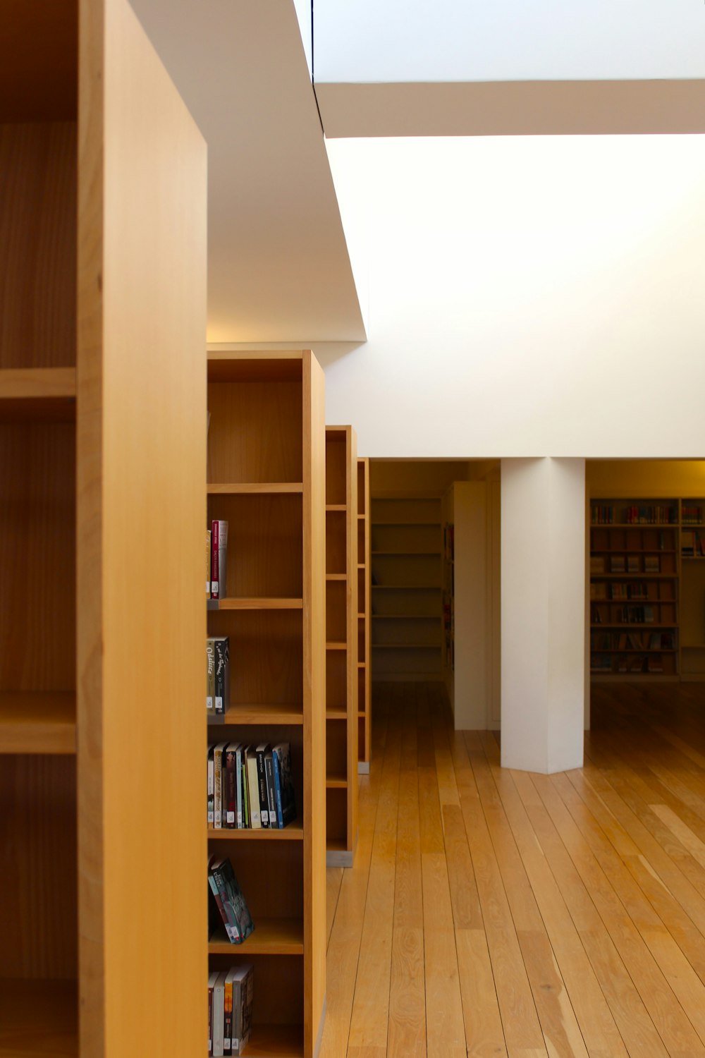 a room with bookshelves and a wood floor