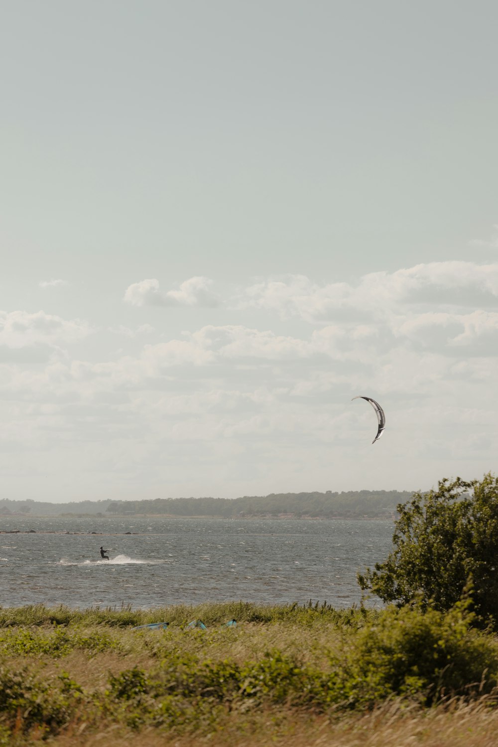 a person kite surfing in the sea