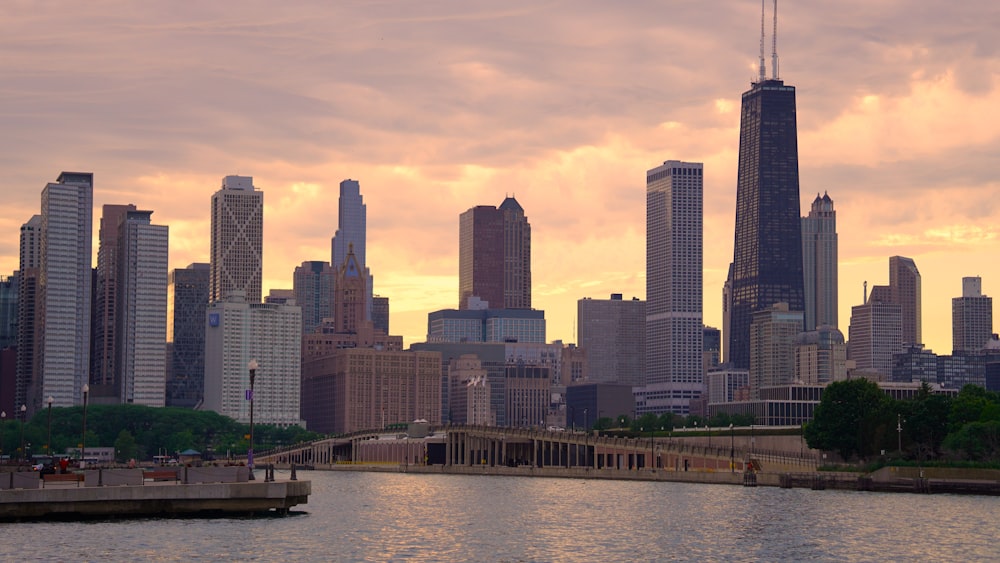 a city skyline with a river