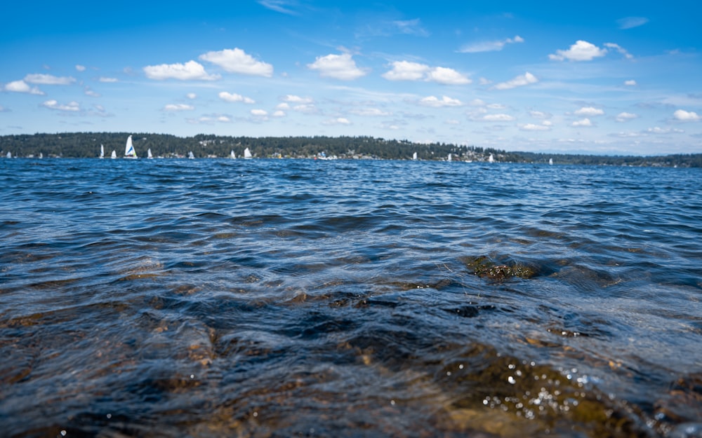 a body of water with a land in the background