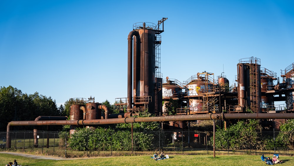 a large factory with a large tower with Gas Works Park in the background