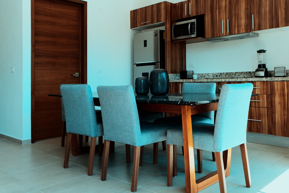 a kitchen with a table and chairs