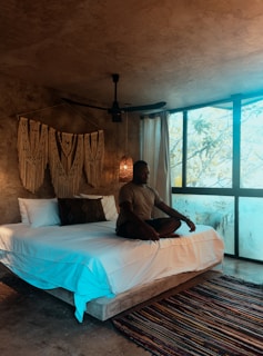 a person sitting on a bed
