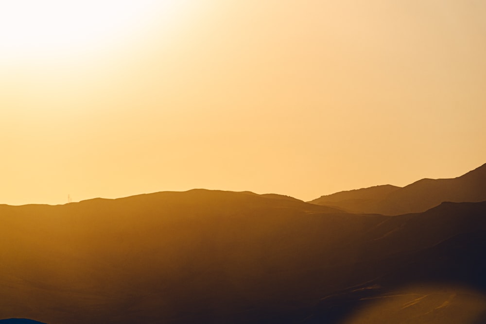 a landscape with hills and a road