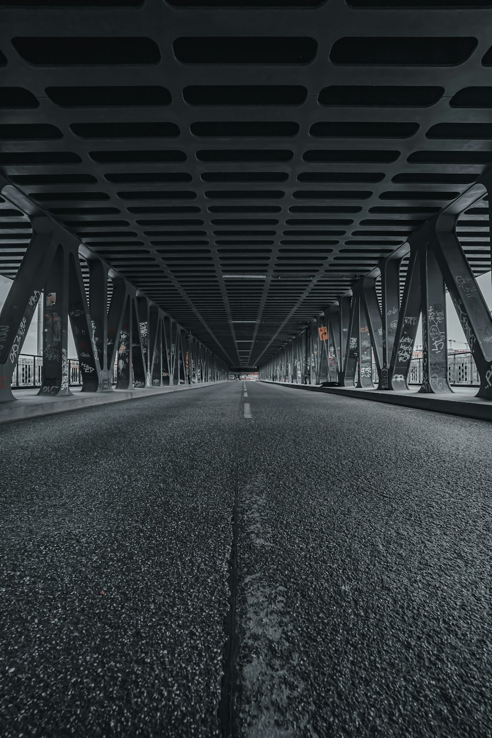 a group of people walking on a bridge