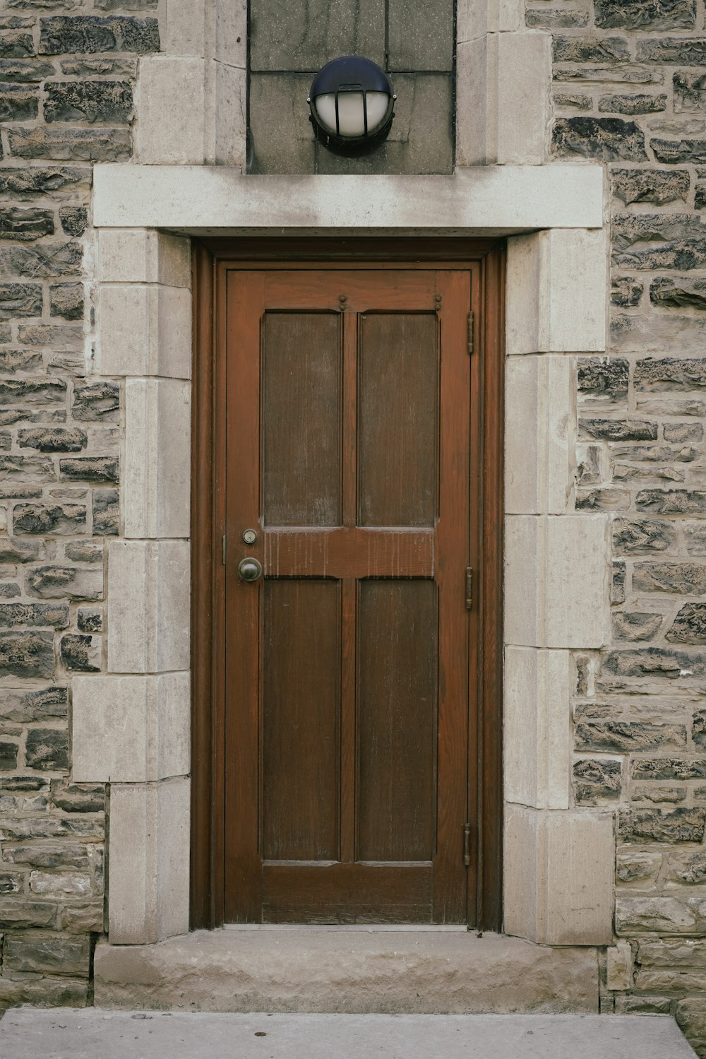 a wooden door in a stone building