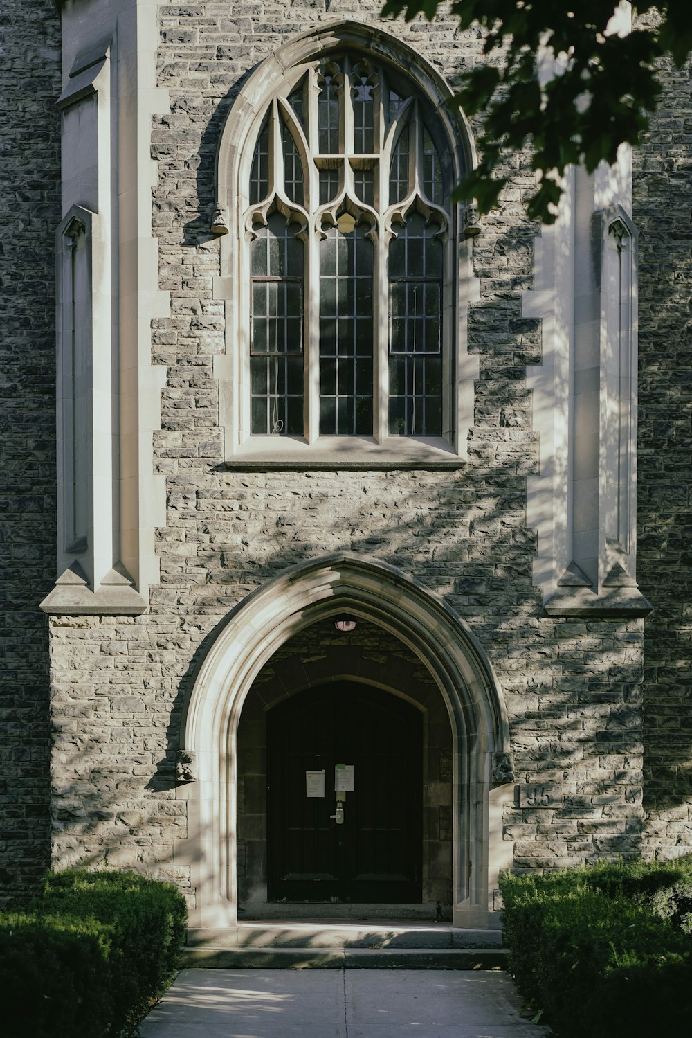 a stone building with a large arched doorway