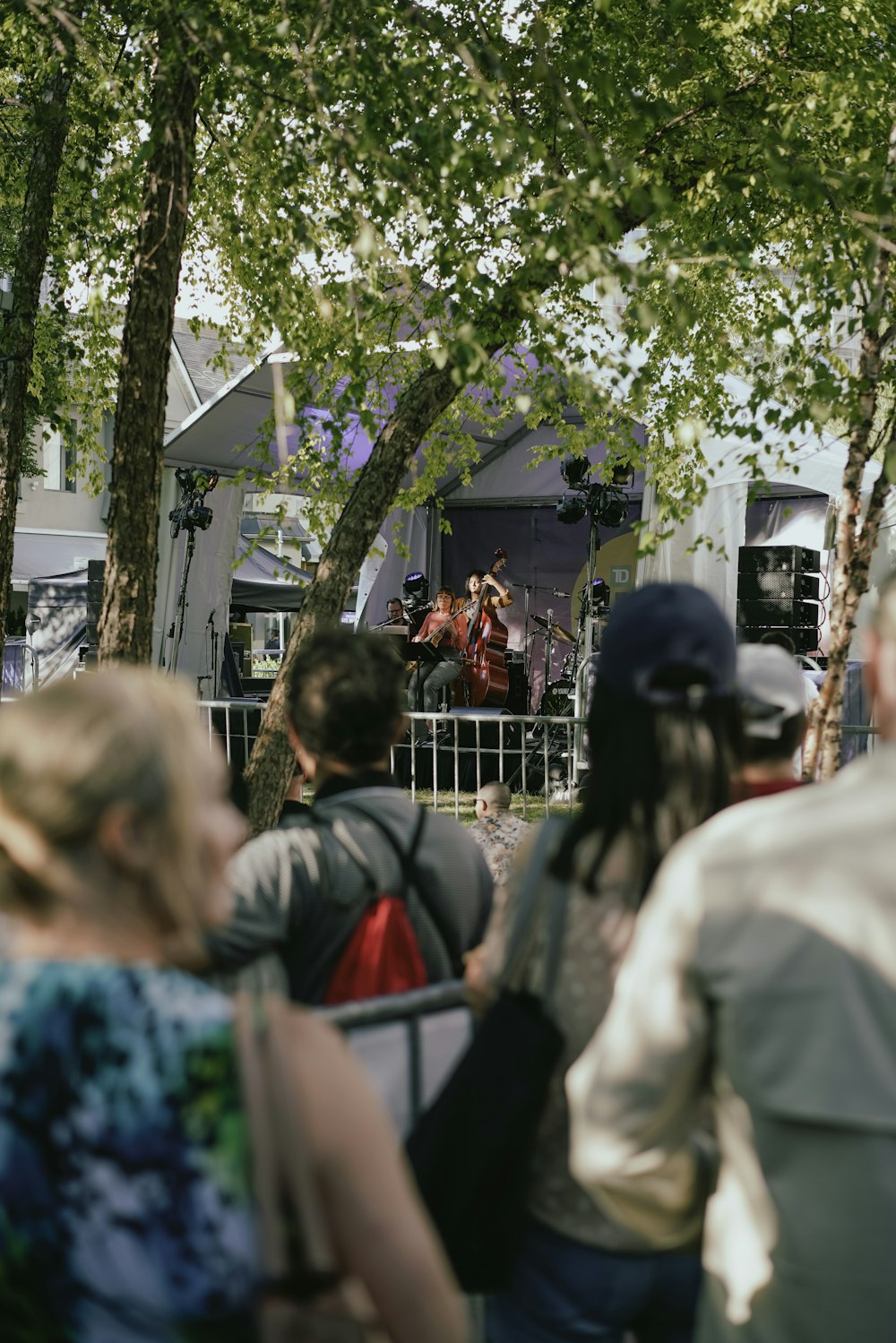 a group of people watching a band on stage