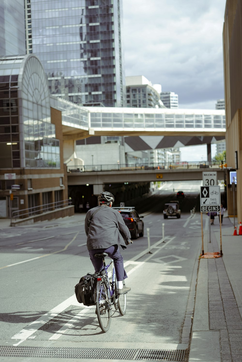 a person riding a bicycle on a city street