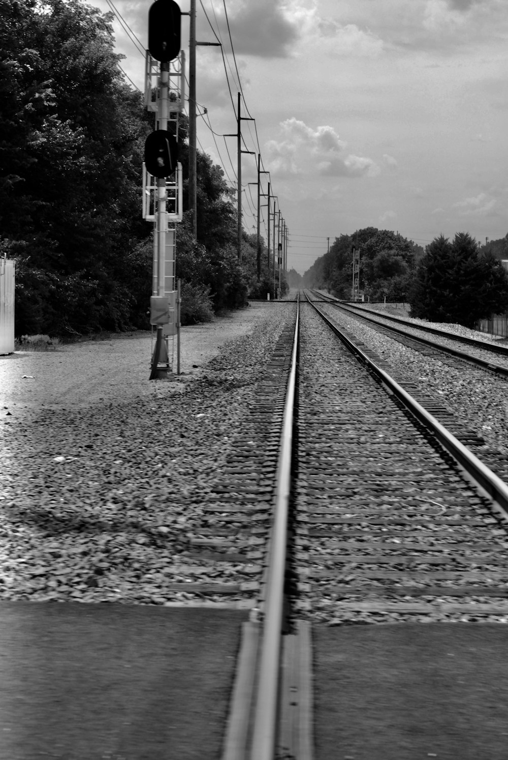 train tracks next to a river