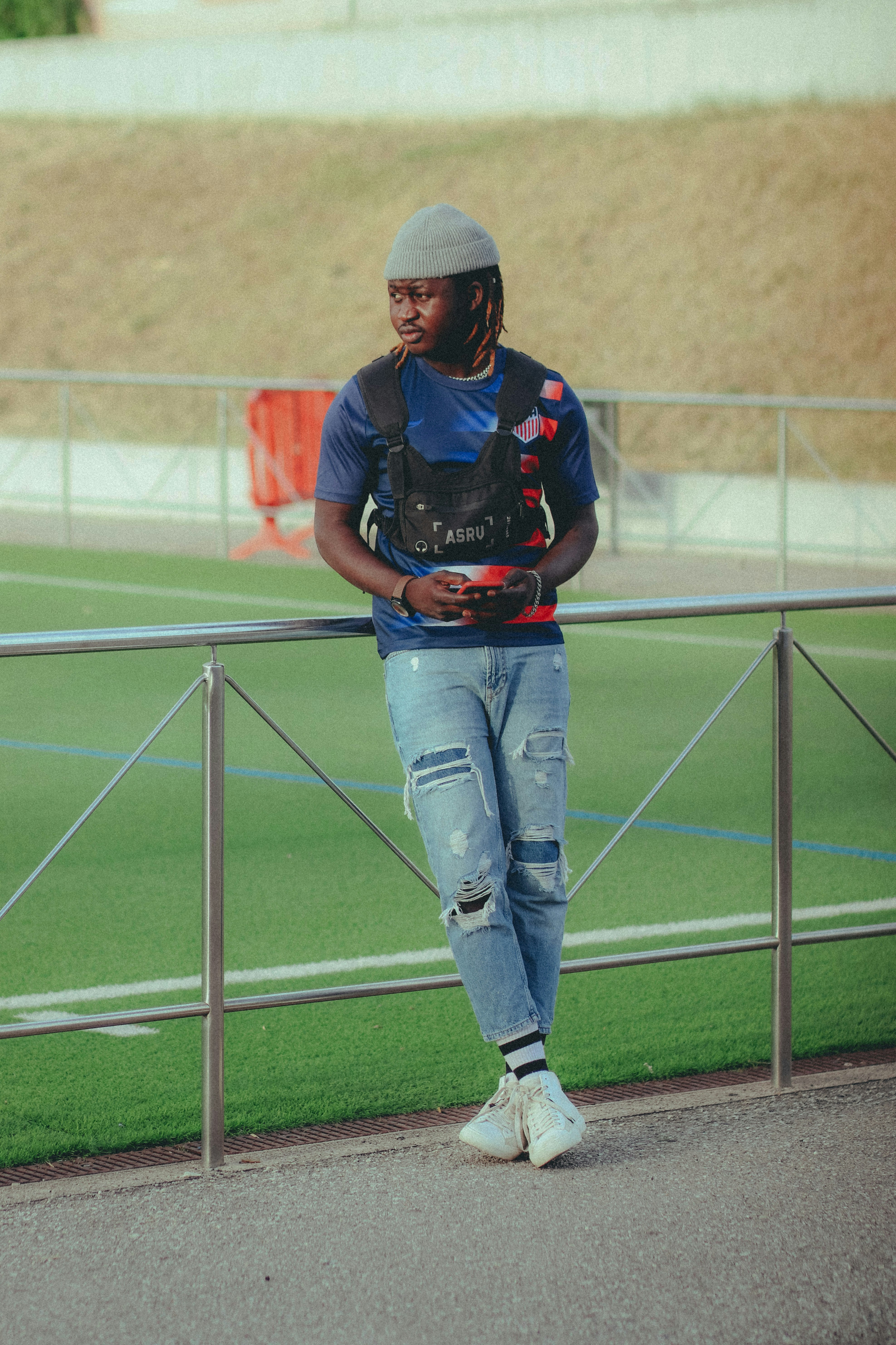 a man in a hat and jeans