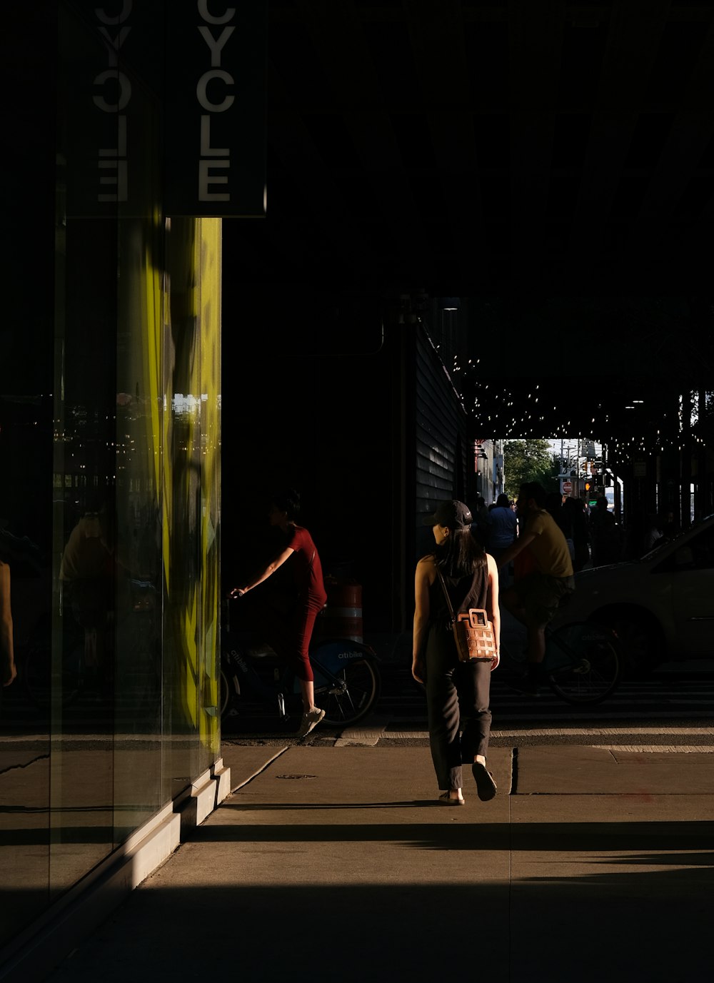 a man walking down a sidewalk