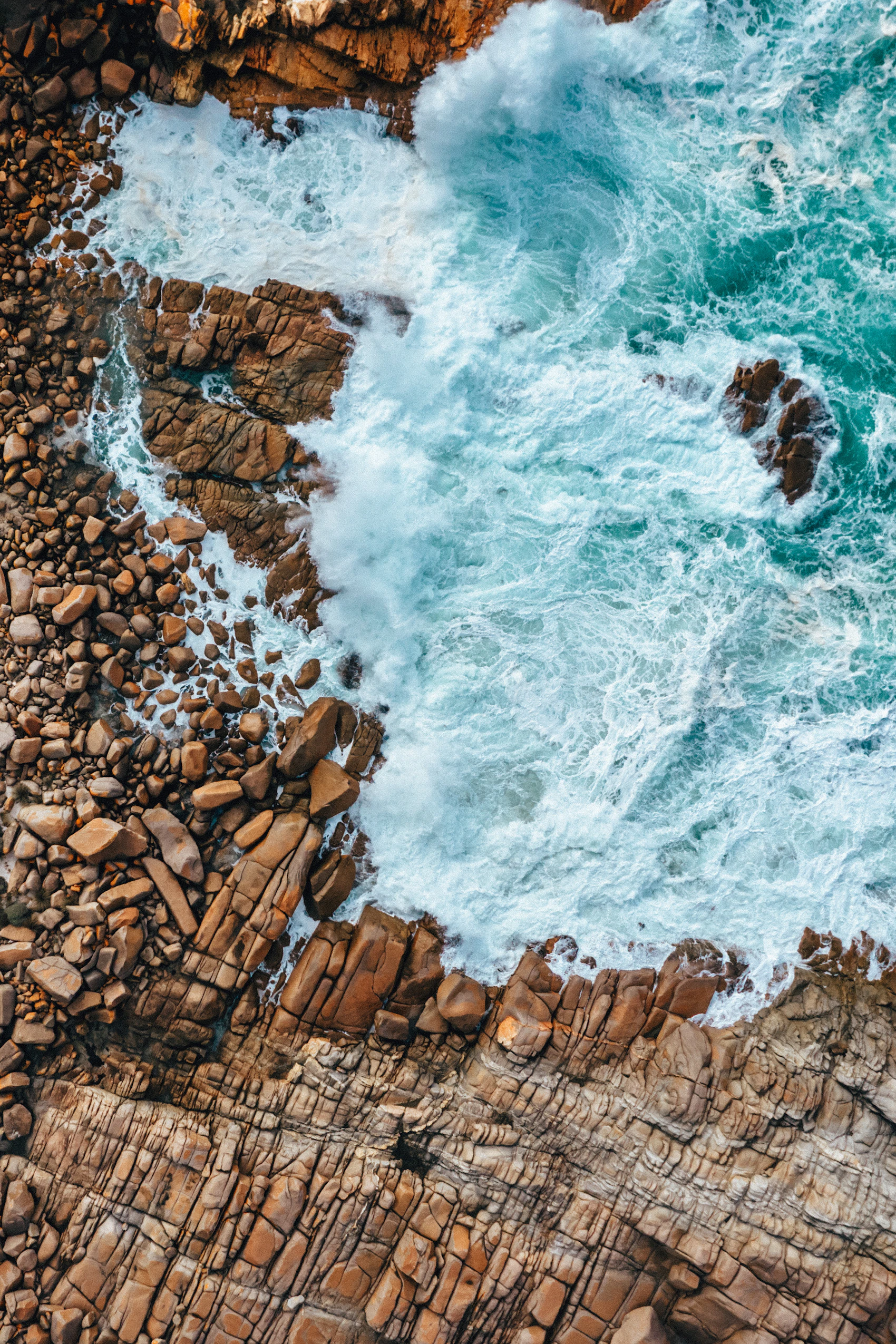 Waves tracing the rugged coastline of Kangaroo Island from above