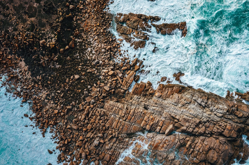 a rocky beach with waves crashing