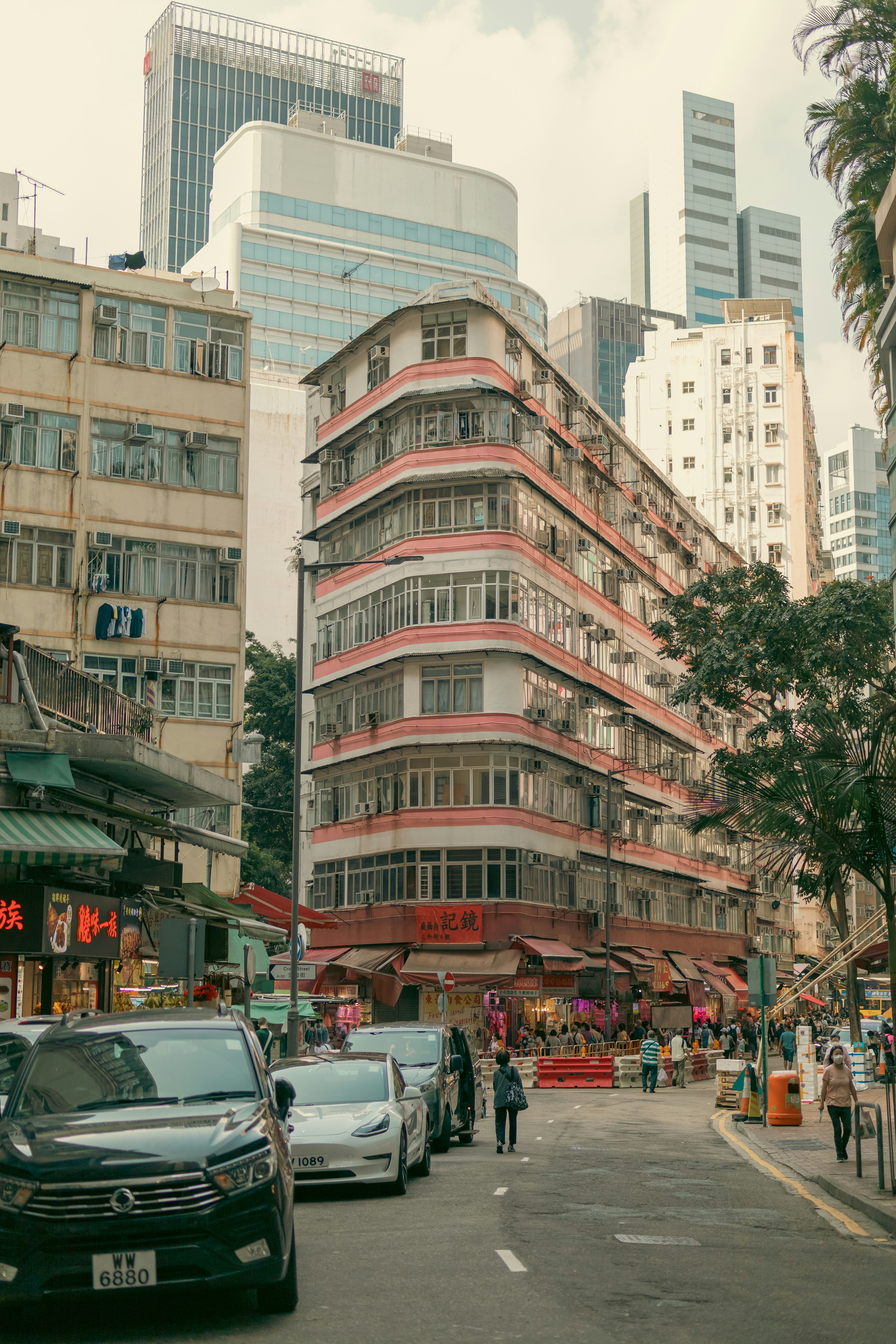 a street with cars and buildings on either side of it