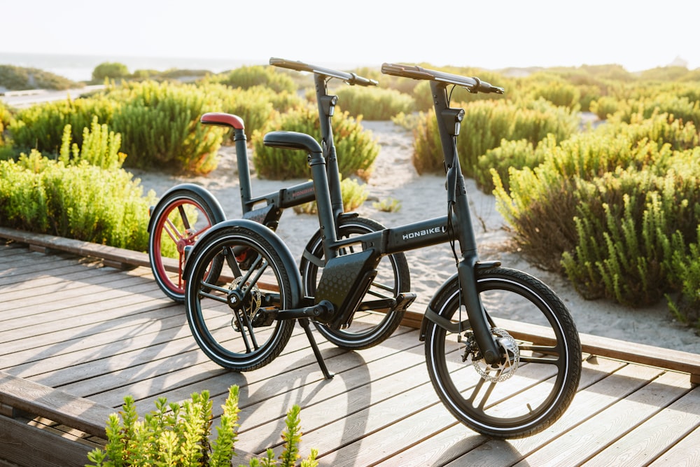 a bicycle parked on a wooden deck