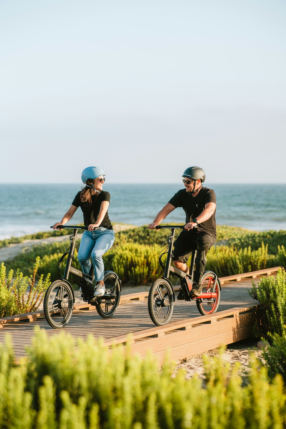 two people riding bikes