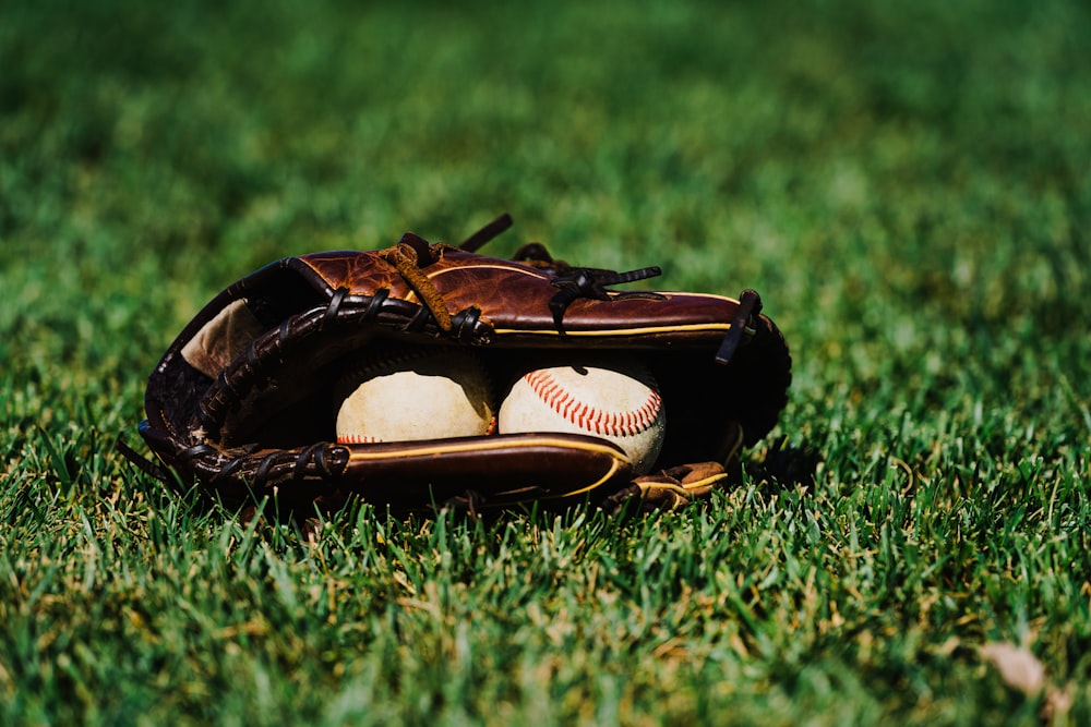 a baseball glove on the grass