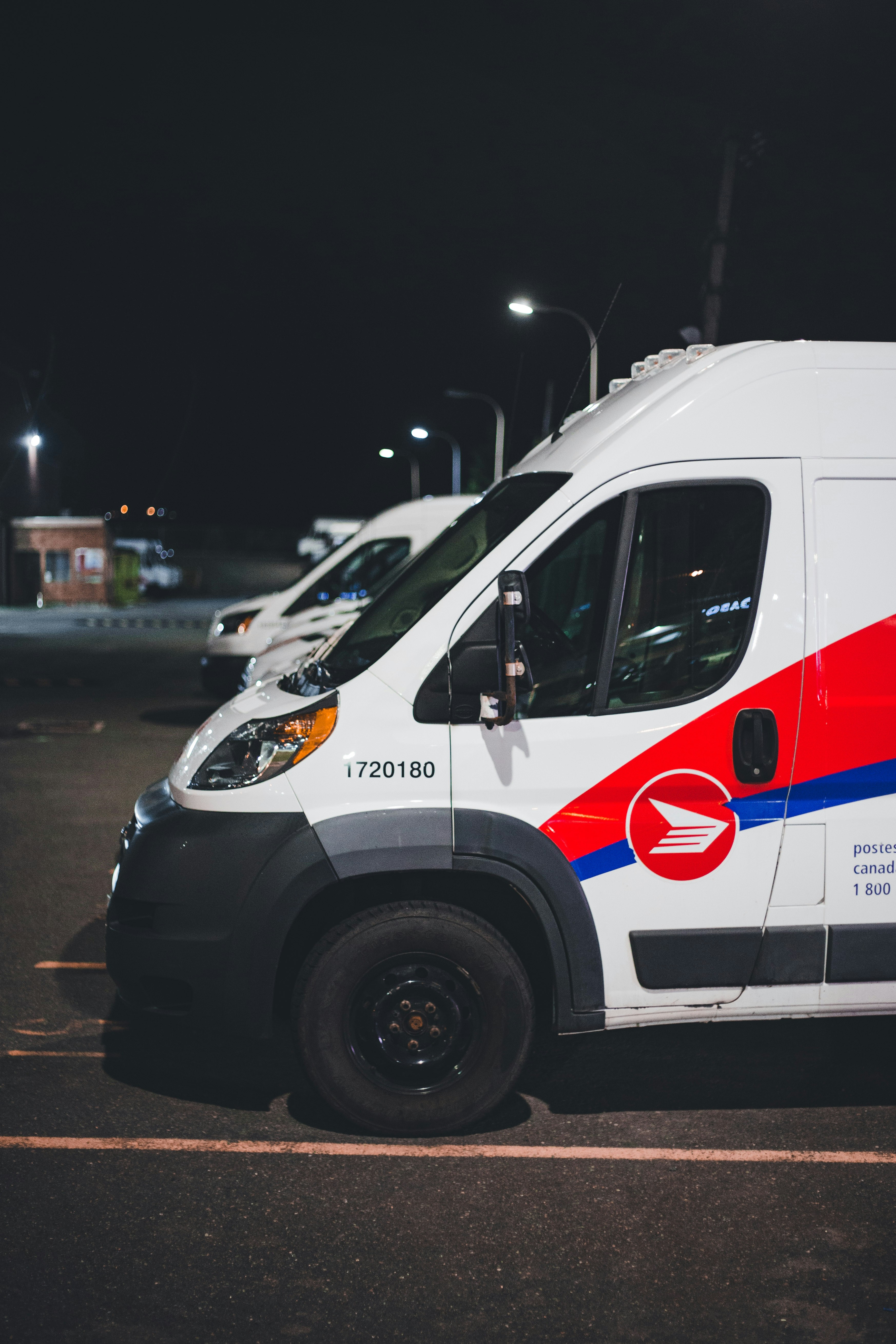 White fleet vehicle with red compliance and identification decals
